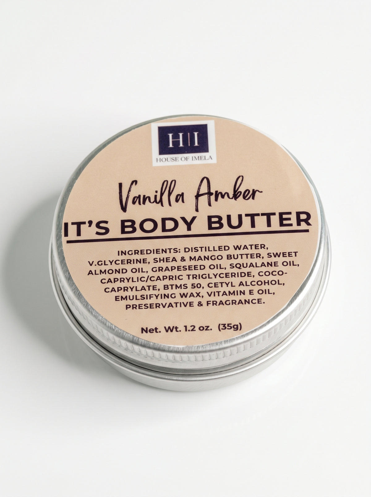 House of Imela Vanilla Amber Body Butter mini tin, 1.2 oz (35 g), lid with ingredients
