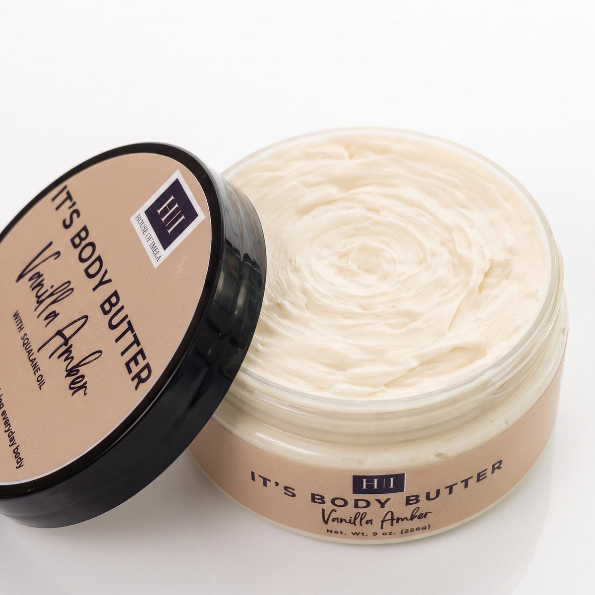 Vanilla Amber Body Butter in an open 9 oz jar, showing its whipped, creamy texture