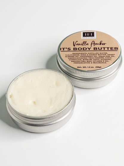 Open Vanilla Amber Body Butter mini tin showing the butter's texture