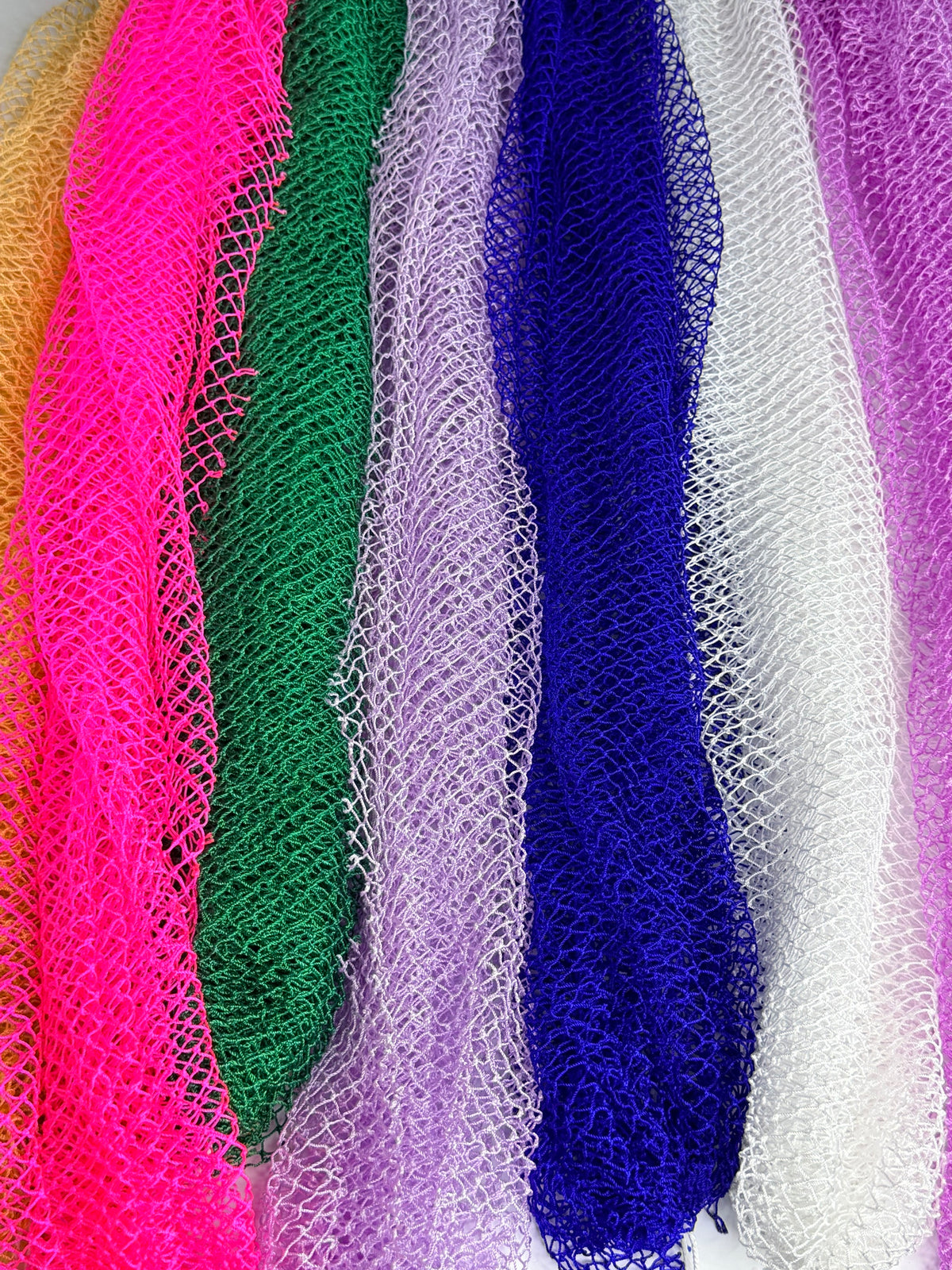 Close-up of African net sponge mesh texture in every color