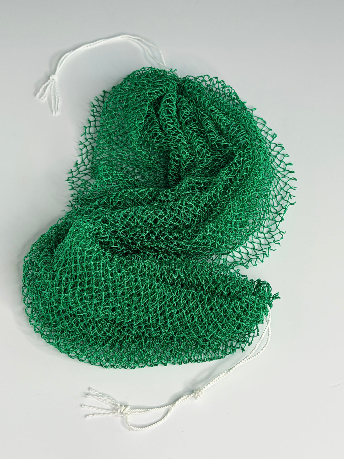 Deep Green African net sponge laid flat