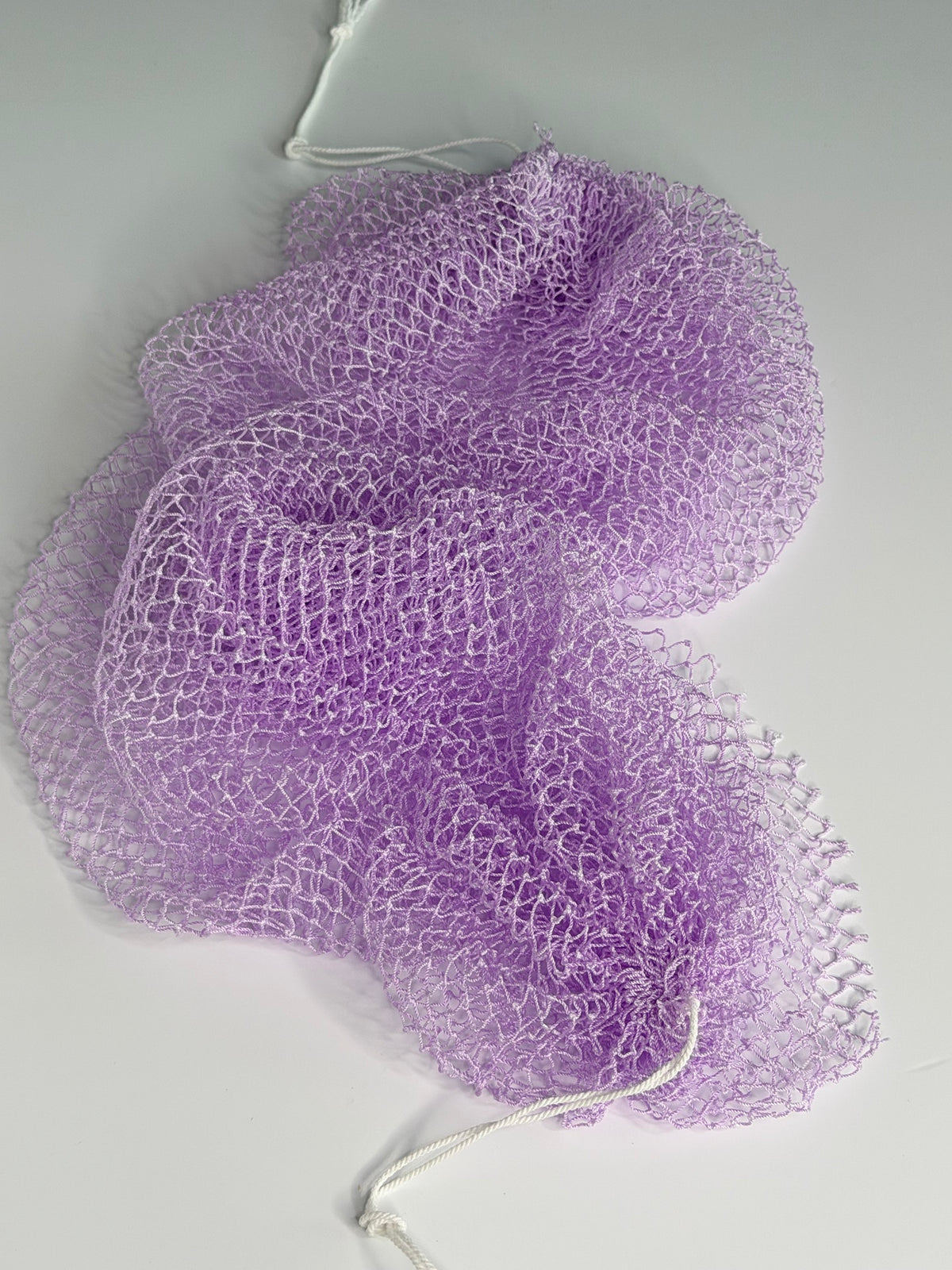 Lavender African net sponge laid flat