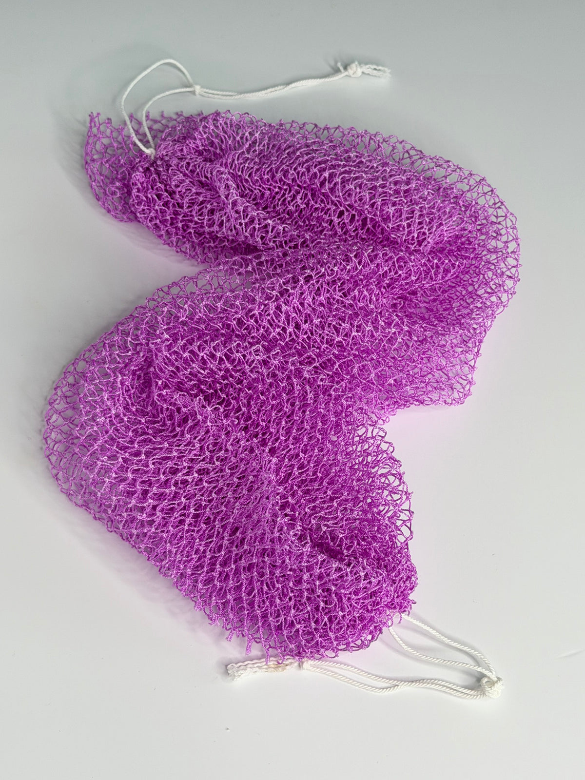 Lilac African net sponge laid flat